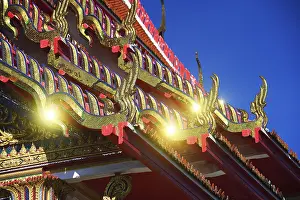 Roof ornaments and pagodas with reflections of the sun