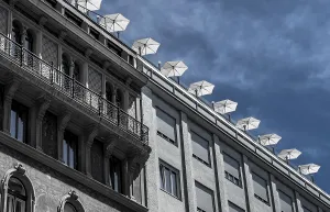 Roof Terrace With Sun Parasols On Historic And Modern Buildings In The Inner City Of Vienna In Austria