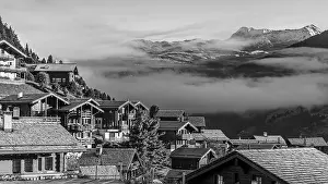 Roofs covered with hoarfrost, fog rising
