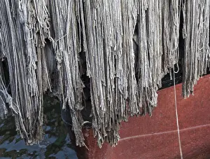 Detail of a rope fender on prow of boat to protect against collision