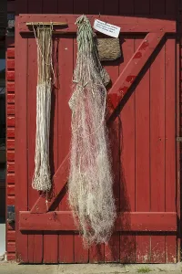 Rope and fishing net on a wooden door