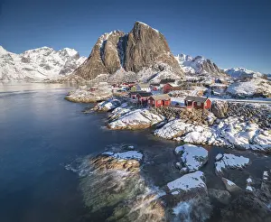 Rorbuer fishermen's cabins on the snowy fjord