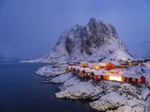 Rorbuer huts of Hamnoy at the fjord at dusk