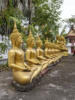 Row of golden Buddha images, Wat That Luang temple