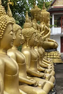 Row of golden Buddha images, Wat That Luang temple