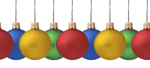 Row pf hanging Christmas baubles isolated on white background