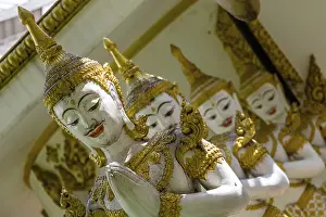 Row of praying mythological figures of the Hindu religion