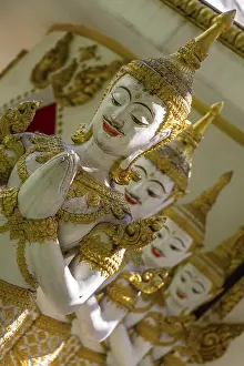 Row of praying mythological figures of the Hindu religion