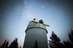 Rozhen astronomical observatory under the night sky stars