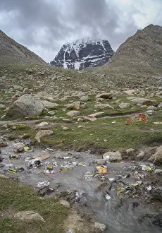 Rubbish in a stream left by trekkers circling Mount Kailash - holy mountain in the Himalaya