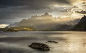 Rugged peaks of the mountain range Trolltindan in the rays of the evening sun