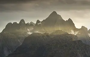 Rugged peaks of the mountain range Trolltindan in the rays of the evening sun