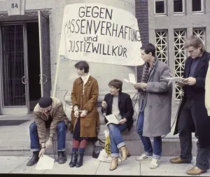 Ruhr area. Alternative in chains at a protest in front of a court