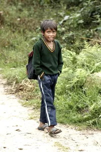 Rural boy walking on road, the Khasi tribe