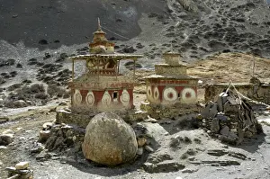 Two rustic choerten with strange red decoration Phu Nar-Phu Annapurna Region Nepal