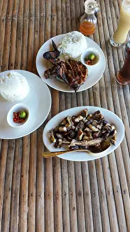 A rustic rural setup with grilled chicken inasal