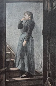 Sad woman standing on the stairs