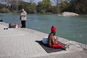 Sadhu mediating on Ganga River in Rishikesh Uttarakhand India