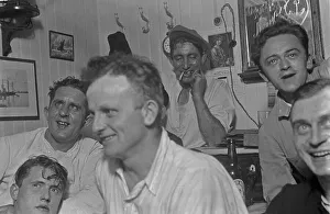 Sailors celebrate on board a cargo ship