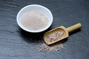 Salt, ground natural salt in bowl and salt crystals in shovel