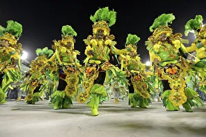 Samba dancers parade of the samba school Beija Flor de Nilopolis
