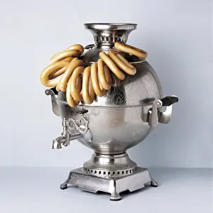 Samovar on the table with a bunch of bagels