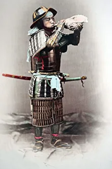 Samurai blowing into conch, Japan, Asia