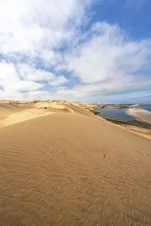 Sand dunes and sea, Atlantic coast and sandy desert with sea of dunes