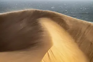 Sand dunes and sea in evening light
