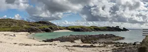 Sandy beach Clachtoll Beach, cloudy sky
