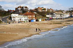 Sandy beach and historic buildings on the seafront on a sunny day in winter at Felixstowe