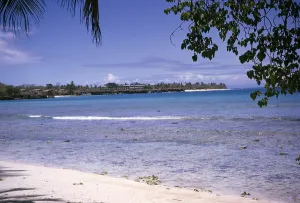 Sandy beach tropical sea with hotel on headland, island of Tobago, 1963