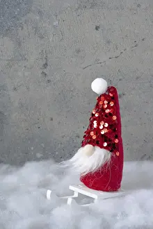 Santa Claus toy on a white wooden sleigh