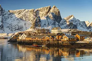 Scandinavian landscape with boathouses at the fjord