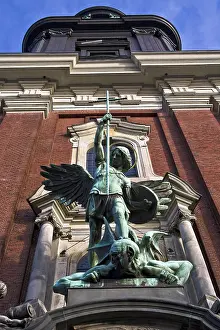 Sculpture of the archangel Michael defeating Satan