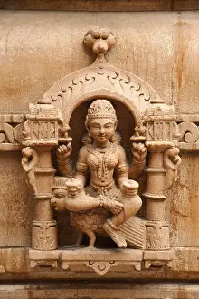 Category Historic EN Prints: Sculpture of goddess chakreshwari sitting on a eagle on the wall of panchasara parasvanath jain temple