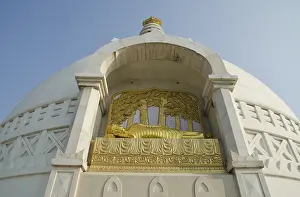 Sculpture of a golden reclining Buddha