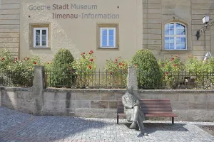 Sculpture of Johann Wolfgang von Goethe sitting on a bench
