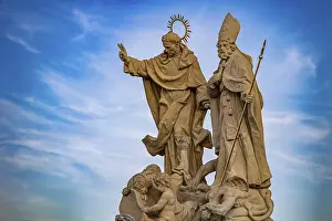 Sculpture of saints under a blue sky