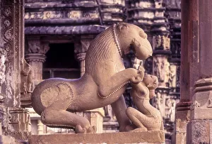 Sculptures of a mythical lion and woman at the Kandariya Mahadeva in Khajuraho