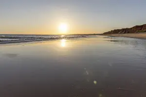 Sea with reflection at low tide in the calm waters of the Atlantic