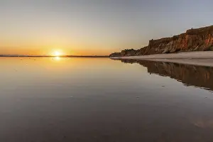 Sea with reflection at low tide in the calm waters of the Atlantic