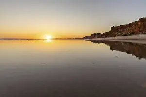 Sea with reflection at low tide in the calm waters of the Atlantic