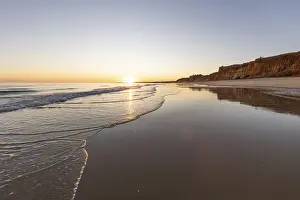 Sea with reflection at low tide in the calm waters of the Atlantic