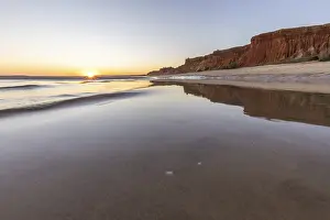 Sea with reflection at low tide in the calm waters of the Atlantic