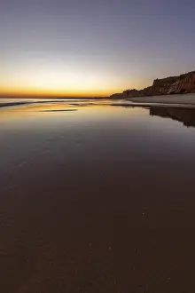 Sea with reflection at low tide in the calm waters of the Atlantic