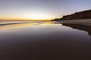 Sea with reflection at low tide in the calm waters of the Atlantic