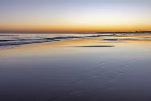 Sea with reflection at low tide in the calm waters of the Atlantic