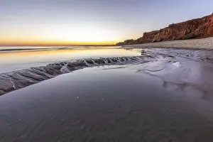 Sea with reflection at low tide in the calm waters of the Atlantic