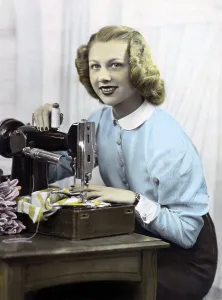 Seamstress, woman at sewing machine